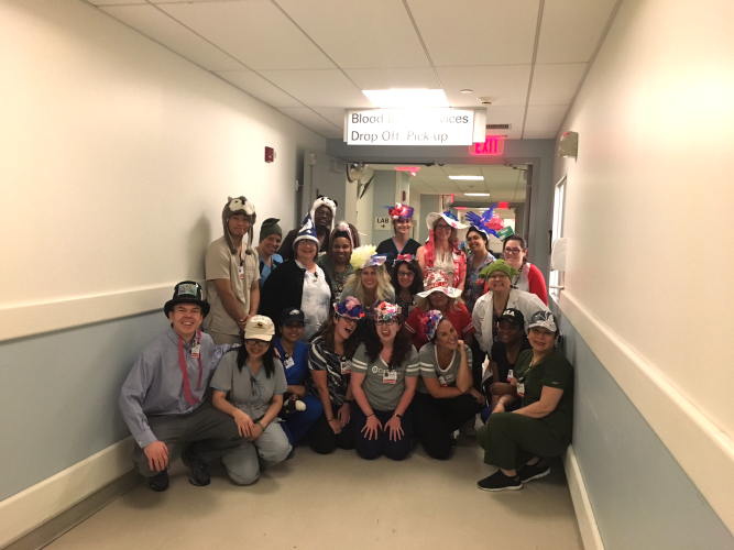 Cooper laboratory team showing off their unique hats on National Hat Day